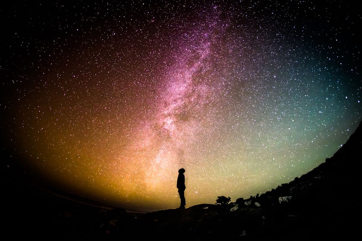 A person gazing up at the Milky Way